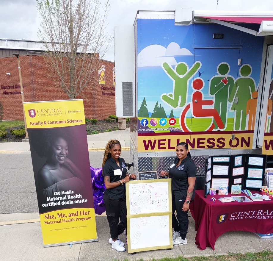 Two CSU Extension doulas promoting the program